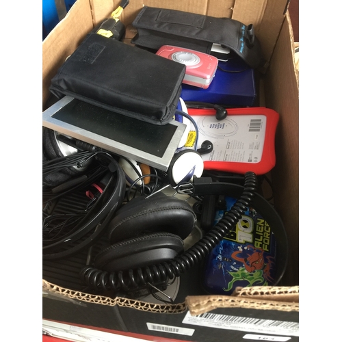 163 - A box of misc electrical items to include folding lamp, headphones, etc.