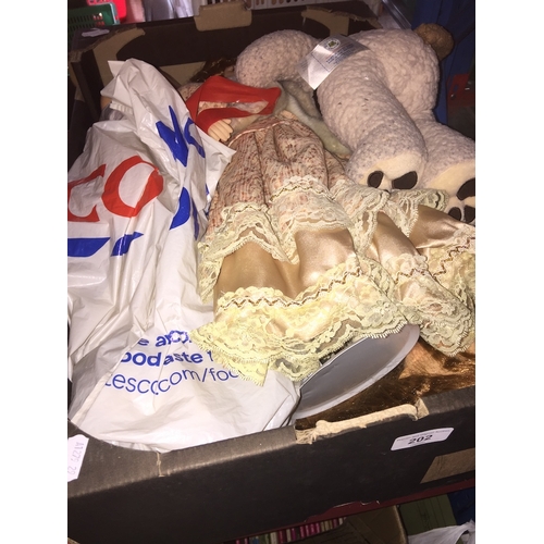 202 - A box with three dolls and a teddy