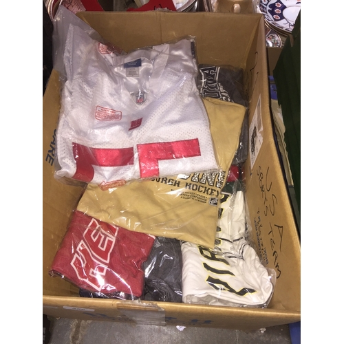 256 - A box containing approx 21 american sports shirts