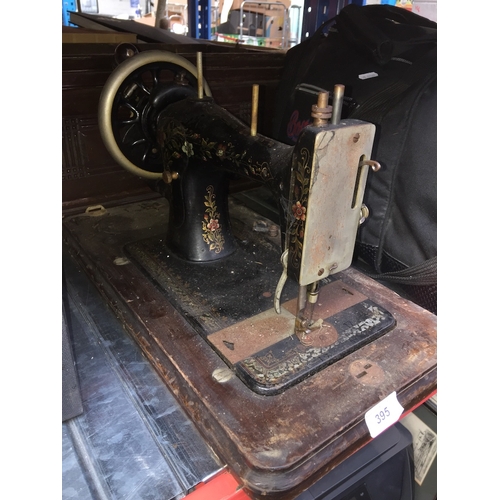 395 - A vintage Bradbury's Family hand cranked sewing machine in wooden case.