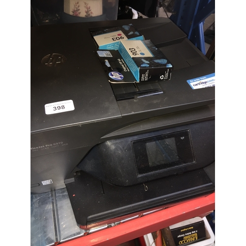 398 - A HP OfficeJet Pro 6970 print / scan / fax / copy / web with additional ink cartridges and cable.