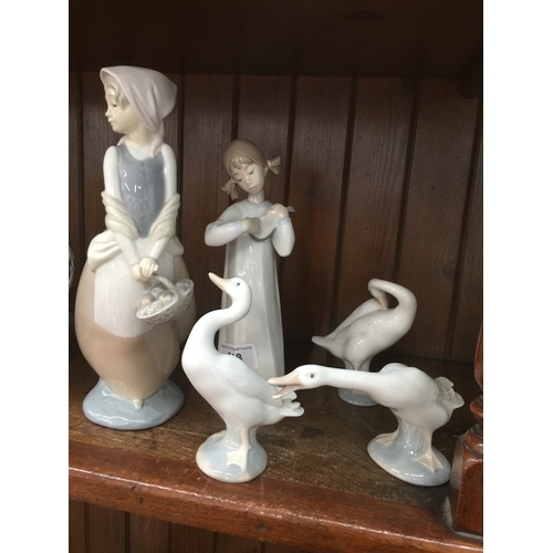 518 - Nao figure, Lladro figure and three Lladro geese