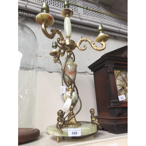 549 - A brass and onyx style three branch candelabra table lamp, H61cm.