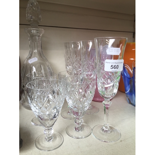 560 - A crystal decanter with 4 Doulton wine glasses and 4 Royal Albert flutes