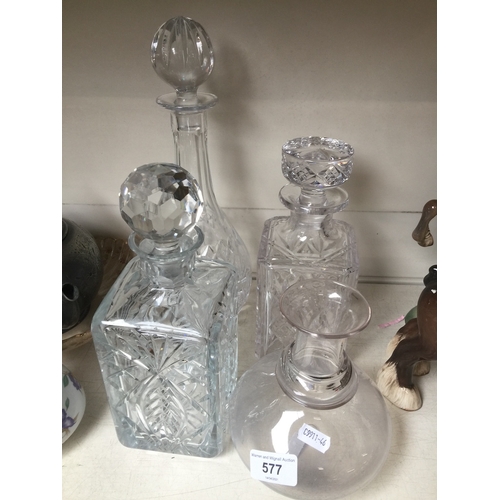 577 - Four glass decanters, 3 with stoppers