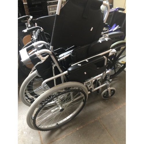 93 - A folding wheelchair, a folding wheelchair with headrest, a mobility walking aid, a folding table an... 