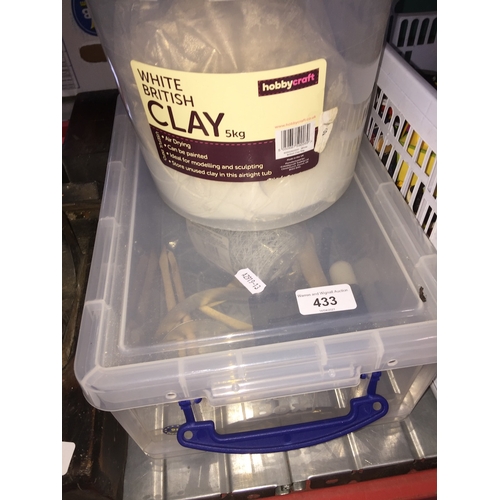 433 - A tub of white clay and tub of modelling accessories