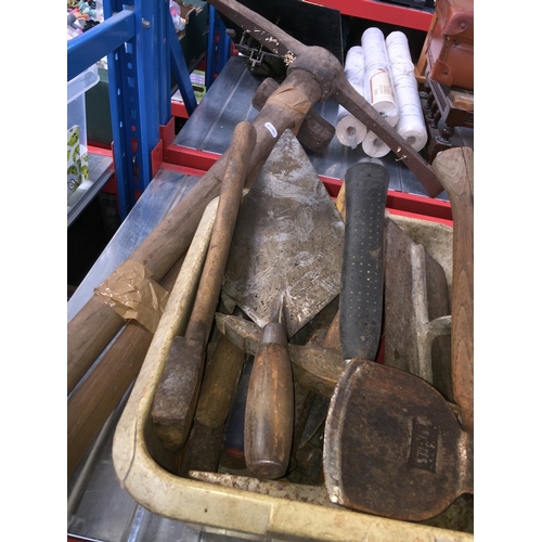 456 - A box of bricklayers tools, a pick axe and a sledge hammer