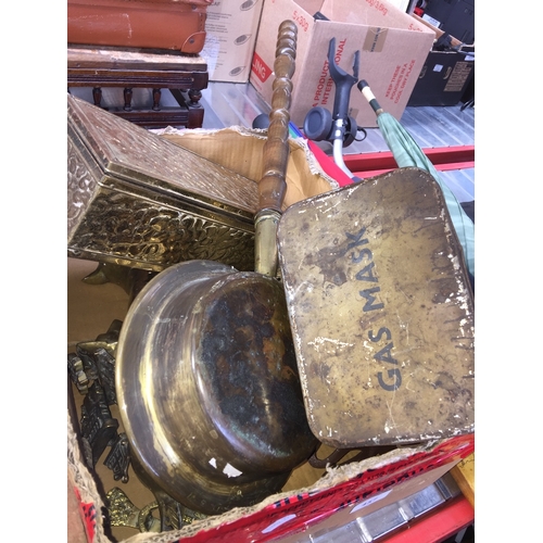 457 - A box of mixed brassware and other items inc. an old gas mask tin/box.