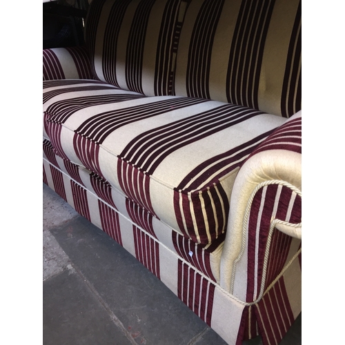 1039 - A good quality three seater sofa with striped upholstery, Peter Guild upholstery retailed by J. Webs... 