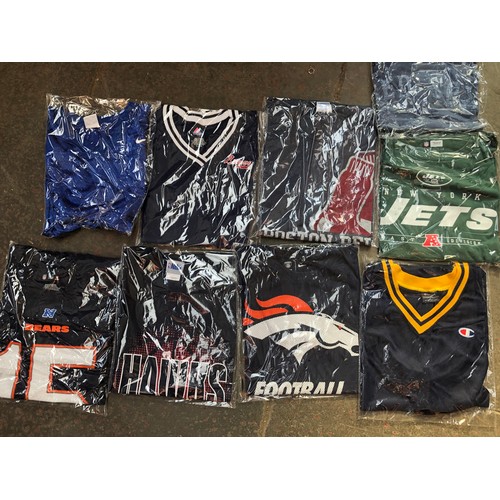 256 - A box containing approx 21 american sports shirts