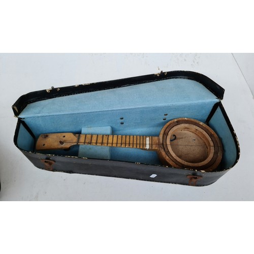 386 - An antique violin and banjo case with banjo -A/F