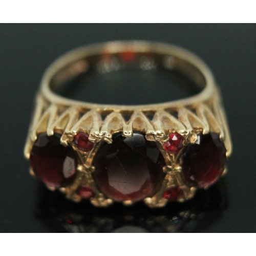 139 - A hallmarked 9ct gold garnet cluster ring, gross weight  3.58g, size N.