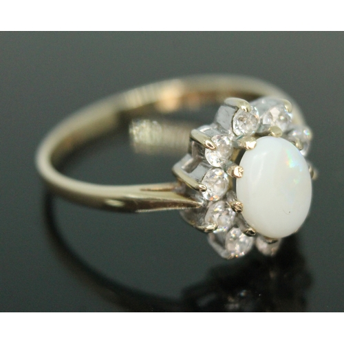 163 - A hallmarked 9ct gold precious opal and colourless stone ring, gross weight 2.44g, size P.