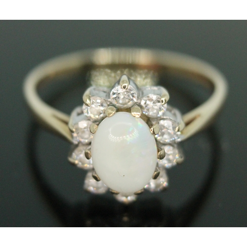 163 - A hallmarked 9ct gold precious opal and colourless stone ring, gross weight 2.44g, size P.