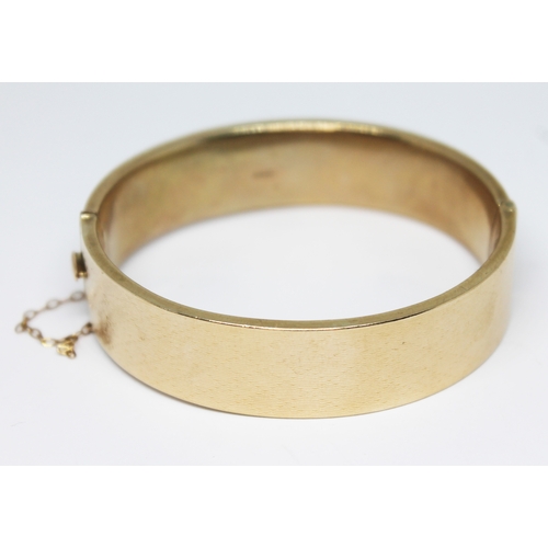 170 - A hallmarked 9ct gold bangle engraved with diamond design, sponsor's mark 'M, G&S', Chester 1935, di... 