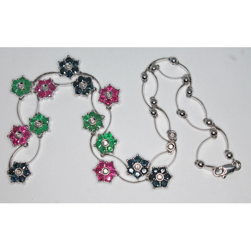 180 - A diamond, sapphire, ruby and emerald necklace, featuring thirteen alternate seven stone clusters wi... 