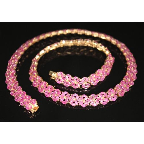 181 - A pink sapphire collar necklace comprising 474 marquis cut pink sapphires weighing approx. 23 carats... 