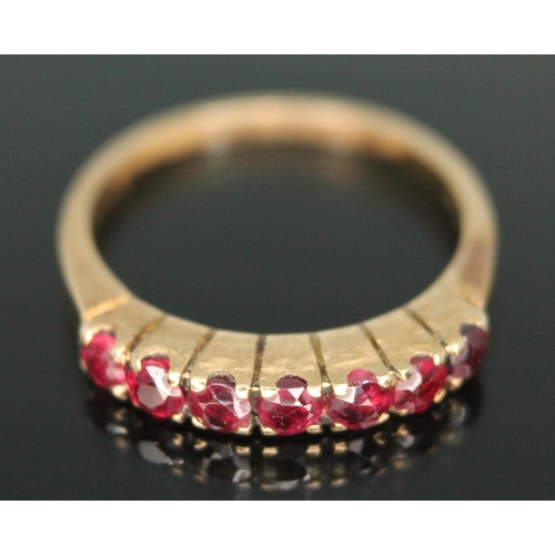 182 - A half hoop ruby ring, marked '585', gross weight 2.33g, size K.