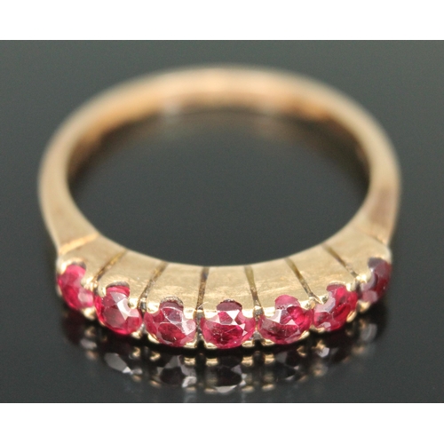 182 - A half hoop ruby ring, marked '585', gross weight 2.33g, size K.