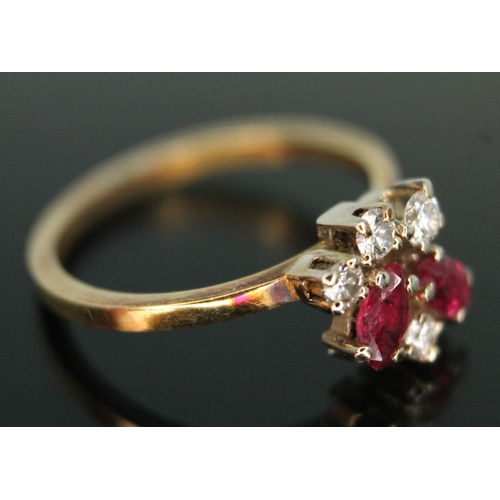 183 - A diamond and ruby cluster ring, the random cluster set with two marquis rubies and three modern rou... 