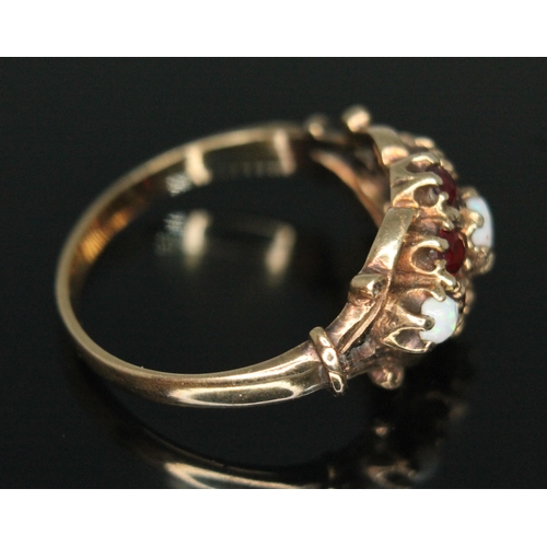 192 - A hallmarked 9ct gold garnet and precious opal cluster ring, gross weight 3.31g, size Q.