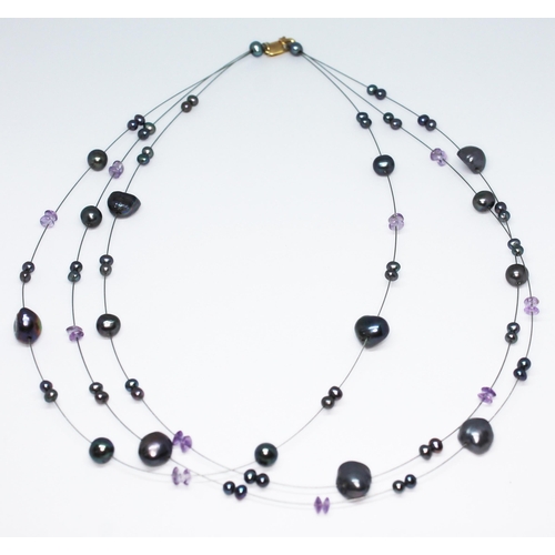 253 - A modern three wire strand beadless cultured pearl and amethyst choker necklace with clasp marled '7... 