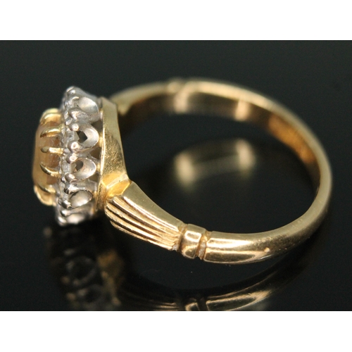 231 - A yellow topaz and diamond cluster ring, the central mixed cut stone measuring approx. 6mm x 4mm x 3... 