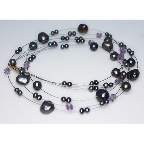 253 - A modern three wire strand beadless cultured pearl and amethyst choker necklace with clasp marled '7... 