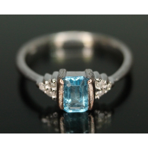 270 - A hallmarked 9ct white gold diamond and topaz ring, gross weight 2.21g, size L.