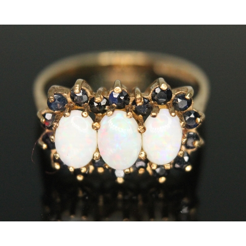 272 - A hallmarked 9ct gold precious opal and sapphire ring, gross weight 2.31g, size M.