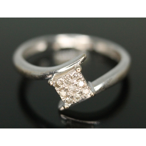 283 - A hallmarked 9ct white gold diamond cluster ring, gross weight 1.95g, size N.