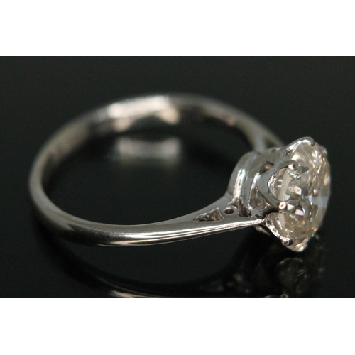 287 - A diamond solitaire ring, early 20th century, the eight claw set slight oval brilliant cut diamond w... 