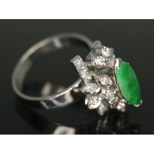 288 - A jade and diamond cocktail ring, the central marquis shaped jadeite jade cabochon measuring approx.... 