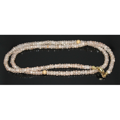 300 - A faceted zircon bead necklace with clasp marked '9ct', length 43cm.