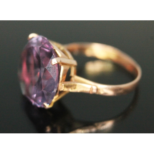 312 - An amethyst ring, the round mixed cut stone weighing 13 carats, Egyptian marks, gross weight 4.34g, ... 