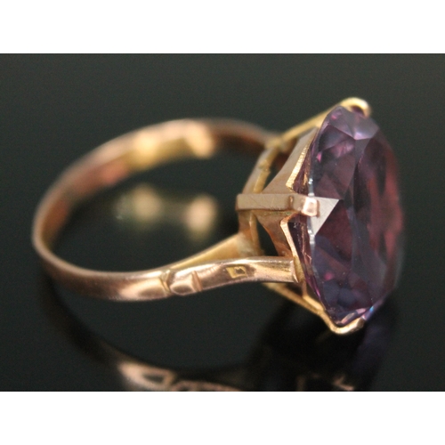 312 - An amethyst ring, the round mixed cut stone weighing 13 carats, Egyptian marks, gross weight 4.34g, ... 