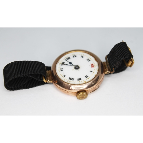 316 - A ladies 9ct gold wristwatch with enamel dial, case diam. 25mm, with ribbon type strap, gross wt. 13... 