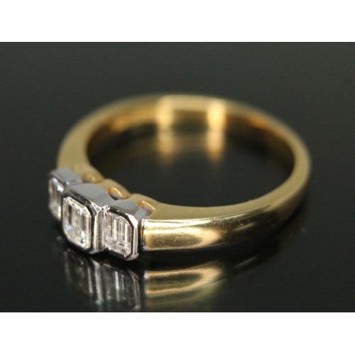 332 - An Art Deco style three bezel set stone diamond ring, the three emerald cut diamonds weighing approx... 