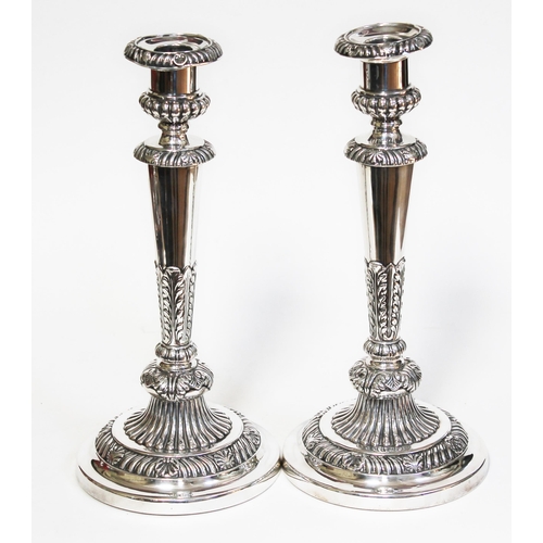 401 - A pair of George III Regency period silver candlesticks with gadrooned, shell and acanthus detail, M... 