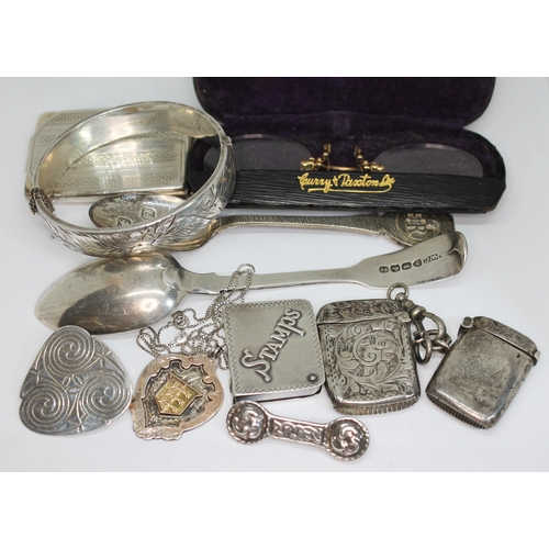 417 - Assorted hallmarked silver and white metal comprising a bangle, two spoons, two vesta cases, a match... 