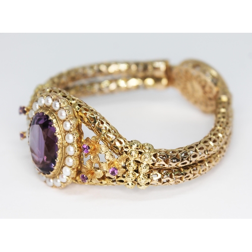 419 - A 9ct gold bracelet set with an oval cut amethyst weighing approx. 9.94 carats and surrounded by twe... 