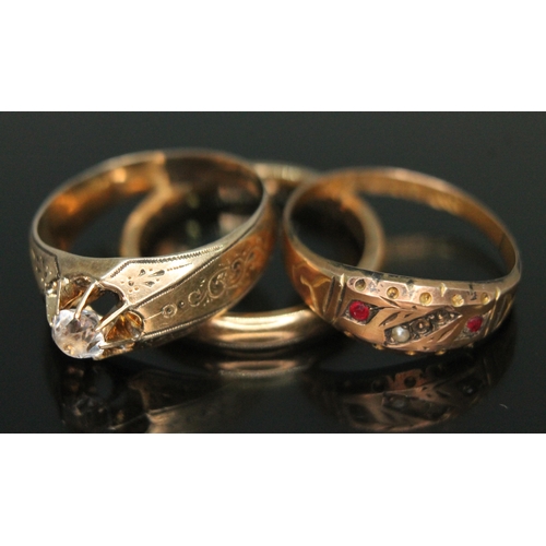 428 - Two hallmarked 9ct gold rings and another unmarked, gross wt. 5.22g, size M/N.