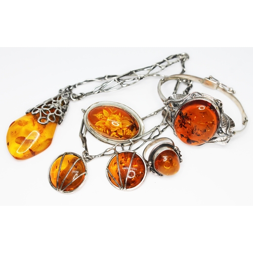 431 - Assorted white metal mounted amber jewellery.