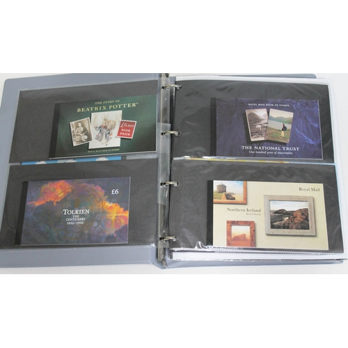 496 - An album of Royal Mail Prestige stamp books, presentation packs, and additional FDCs, mostly high va... 