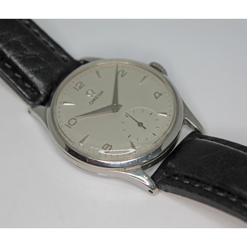 132 - A 1950 Omega 13322 stainless steel wristwatch with signed silvered dial having Arabic numerals, hour... 