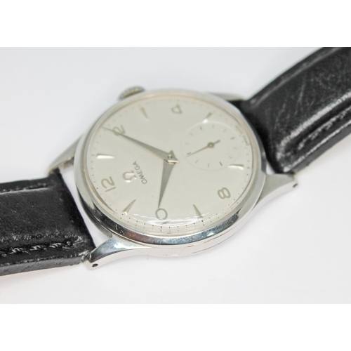 132 - A 1950 Omega 13322 stainless steel wristwatch with signed silvered dial having Arabic numerals, hour... 