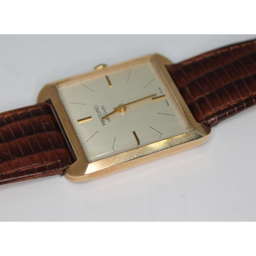 92 - A vintage 1970s 9ct gold Record de luxe wristwatch, the signed gold tone dial with hour and hand bat... 