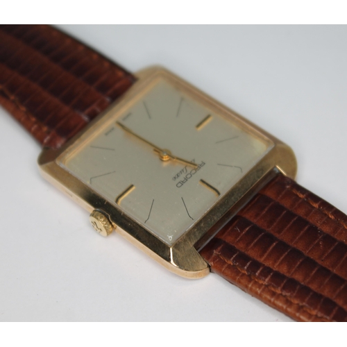 92 - A vintage 1970s 9ct gold Record de luxe wristwatch, the signed gold tone dial with hour and hand bat... 