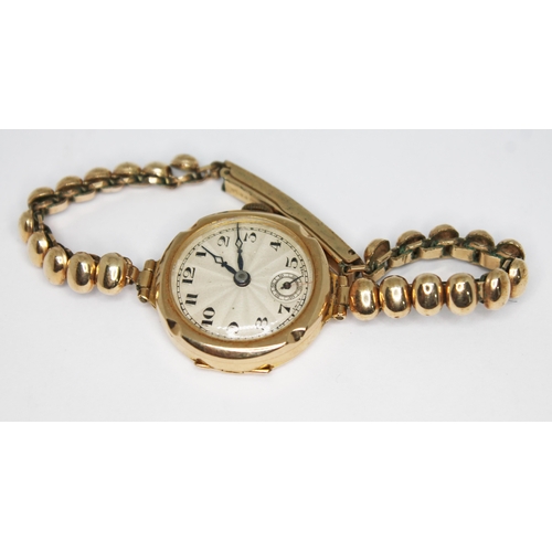 99 - A 1930s hallmarked 9ct gold ladies wristwatch, the unsigned guilloche dial having Arabic numerals an... 